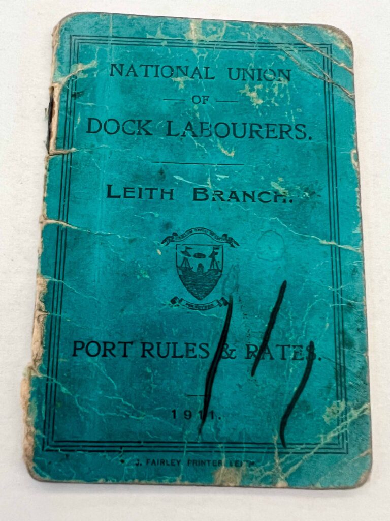 Turquoise book with ragged cover.